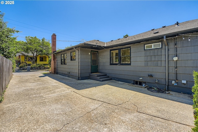 815/821 NE Holman St, Portland, OR 97211 - rear view of house with a patio