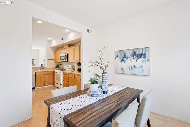 2732 NW Kennedy Ct, Portland, OR 97229 - dining room featuring light wood-type flooring and recessed lighting