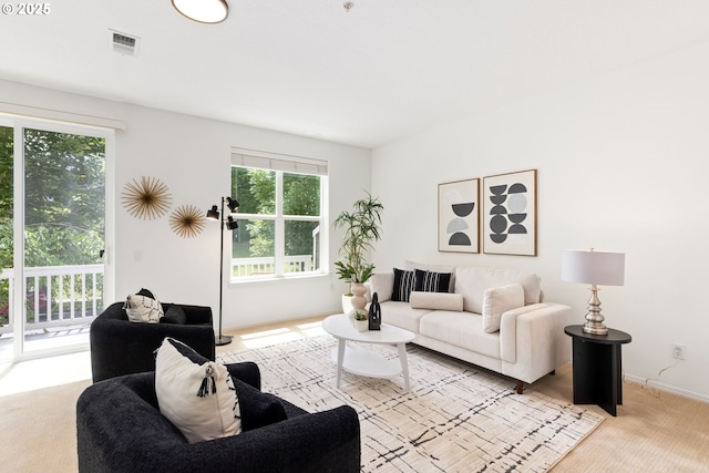 2732 NW Kennedy Ct, Portland, OR 97229 - living area featuring healthy amount of natural light and light colored carpet