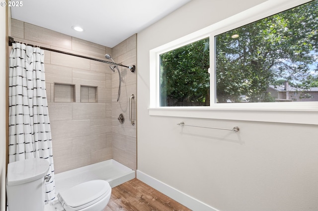 40 SW 150th Ave, Beaverton, OR 97006 - bathroom featuring tiled shower, wood finished floors, and recessed lighting