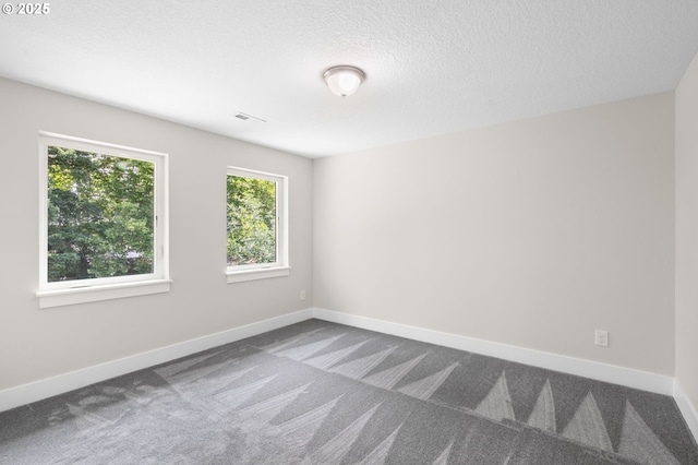 40 SW 150th Ave, Beaverton, OR 97006 - empty room with dark colored carpet and a textured ceiling