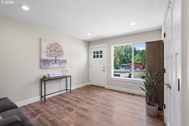 40 SW 150th Ave, Beaverton, OR 97006 - entryway with wood finished floors, a textured ceiling, and recessed lighting
