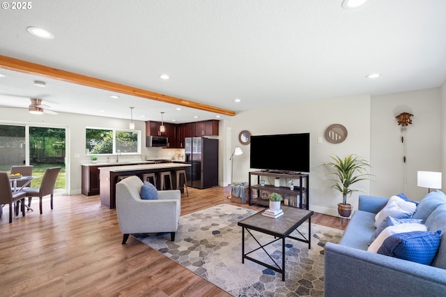 40 SW 150th Ave, Beaverton, OR 97006 - living room with light wood finished floors, beamed ceiling, recessed lighting, and a ceiling fan