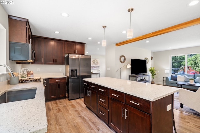 40 SW 150th Ave, Beaverton, OR 97006 - kitchen featuring appliances with stainless steel finishes, light wood finished floors, a kitchen island, pendant lighting, and recessed lighting