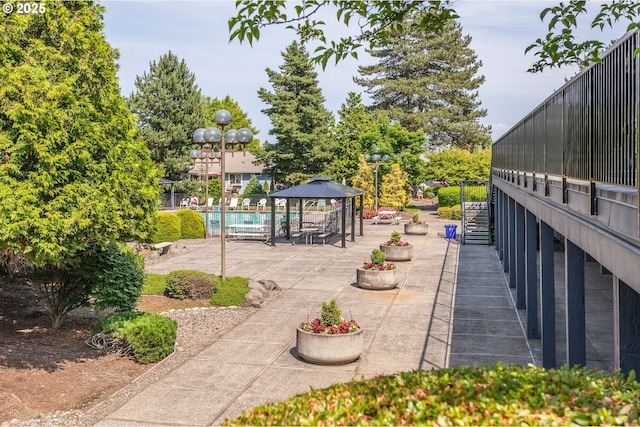 15015 NE Sacramento St Unit 51, Portland, OR 97230 - view of patio / terrace with a gazebo and a community pool