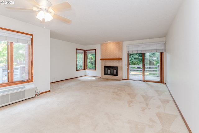 15015 NE Sacramento St Unit 51, Portland, OR 97230 - unfurnished living room with carpet, a fireplace, and a ceiling fan