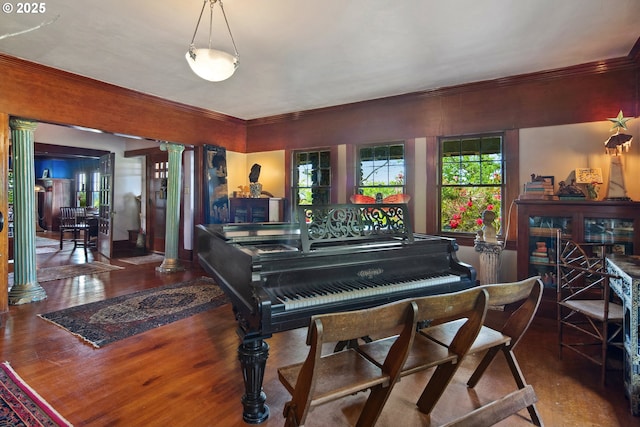91755 Lewis And Clark Rd, Astoria, OR 97103 - living area with wood finished floors, decorative columns, and crown molding