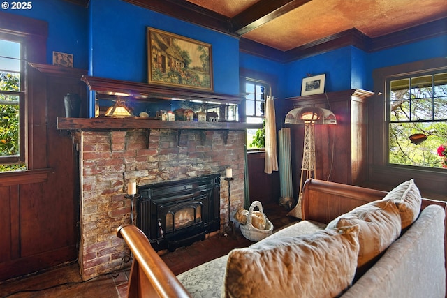 91755 Lewis And Clark Rd, Astoria, OR 97103 - living room with ornamental molding, beamed ceiling, and wood finished floors