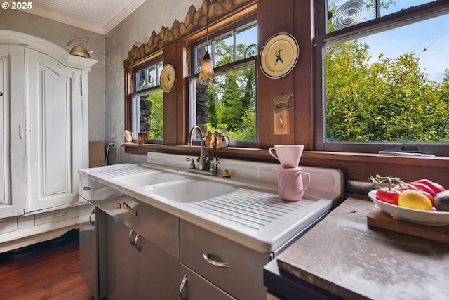 91755 Lewis And Clark Rd, Astoria, OR 97103 - kitchen featuring wood finished floors, ornamental molding, and light countertops