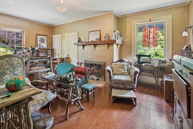 91755 Lewis And Clark Rd, Astoria, OR 97103 - living area featuring a fireplace, hardwood / wood-style floors, and crown molding