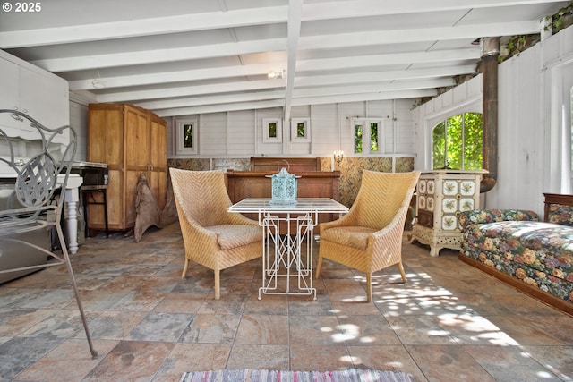 91755 Lewis And Clark Rd, Astoria, OR 97103 - dining space with beam ceiling and stone tile flooring