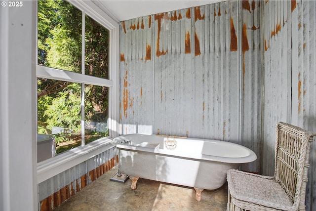 91755 Lewis And Clark Rd, Astoria, OR 97103 - bathroom with unfinished concrete floors and a freestanding bath
