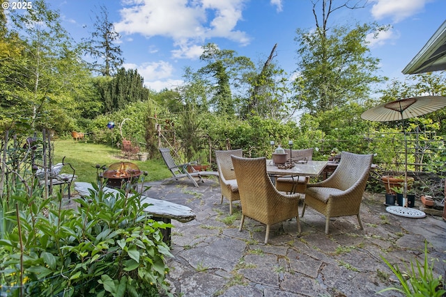 91755 Lewis And Clark Rd, Astoria, OR 97103 - view of patio with an outdoor fire pit and outdoor dining area