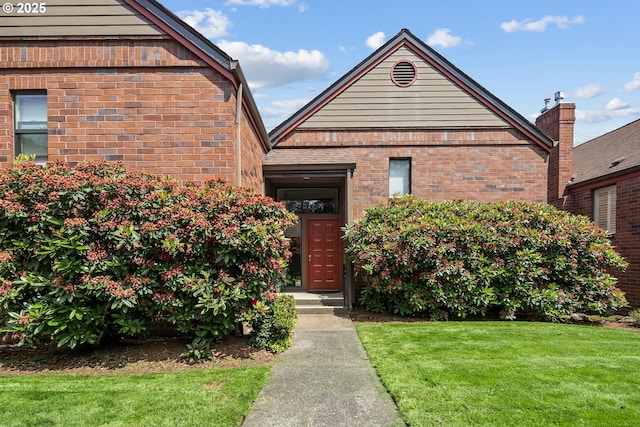 15565 SW 114th Ct Unit 23, Portland, OR 97224 - view of front facade featuring a front lawn and brick siding
