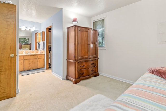 15565 SW 114th Ct Unit 23, Portland, OR 97224 - bedroom featuring light carpet, ensuite bathroom, and electric panel