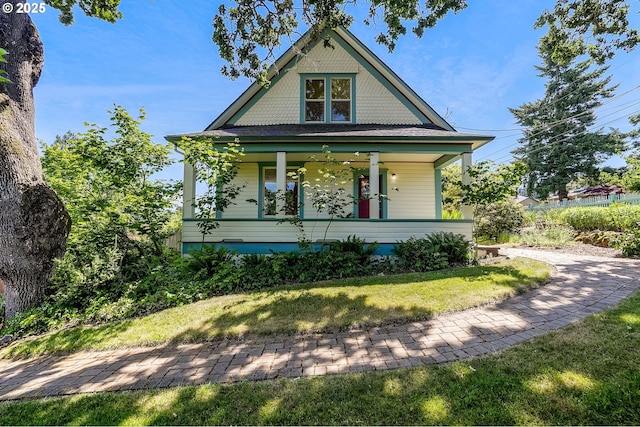 1005 Reserve St, Silverton, OR 97381 - victorian home featuring covered porch and a front lawn
