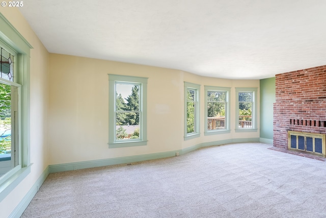 1005 Reserve St, Silverton, OR 97381 - unfurnished living room featuring healthy amount of natural light, carpet, and a fireplace