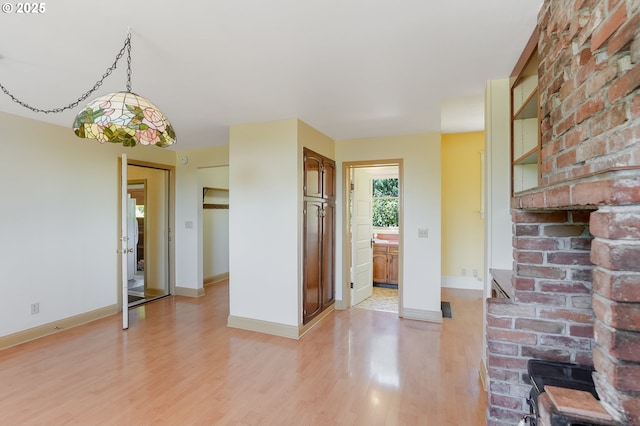 1005 Reserve St, Silverton, OR 97381 - interior space with light wood-style floors and hanging light fixtures