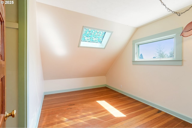 1005 Reserve St, Silverton, OR 97381 - bonus room featuring a skylight, lofted ceiling, and hardwood / wood-style floors