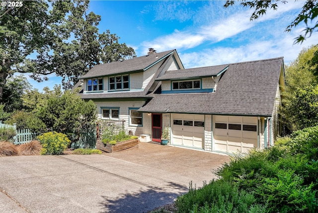 1005 Reserve St, Silverton, OR 97381 - view of front of home featuring driveway, a chimney, a shingled roof, and an attached garage