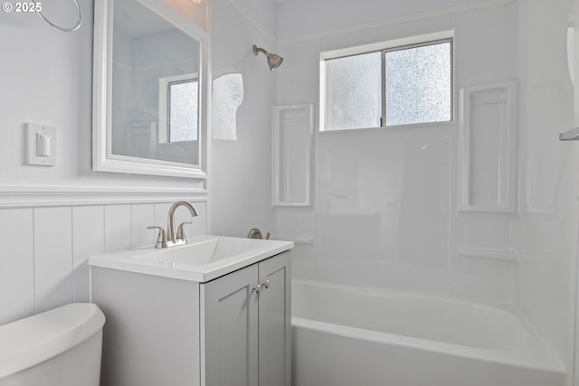 full bathroom with vanity, washtub / shower combination, and toilet