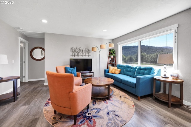 48521 E 1st St, Oakridge, OR 97463 - living area with wood finished floors, attic access, baseboards, and recessed lighting