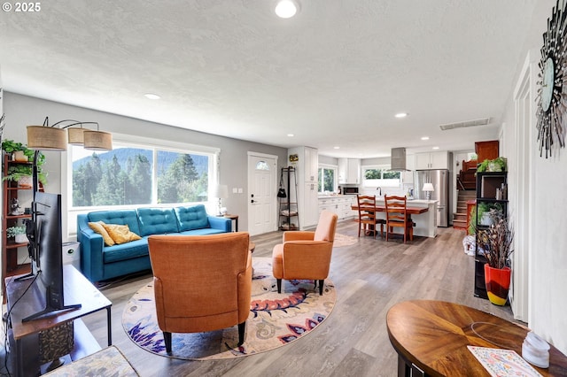 48521 E 1st St, Oakridge, OR 97463 - living room featuring light wood-style floors, healthy amount of natural light, and recessed lighting