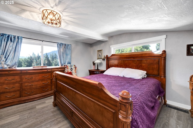 48521 E 1st St, Oakridge, OR 97463 - bedroom with wood finished floors, lofted ceiling, multiple windows, and baseboards