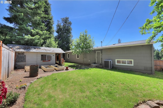 48521 E 1st St, Oakridge, OR 97463 - rear view of house with cooling unit and a vegetable garden