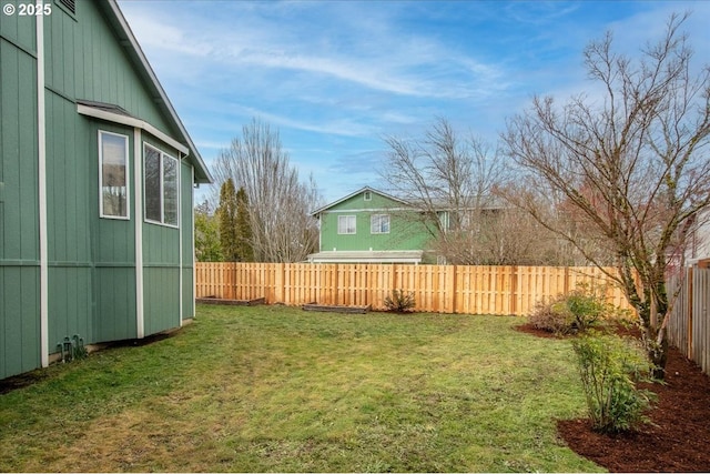 view of yard featuring a fenced backyard