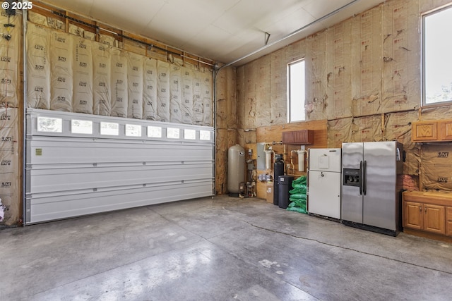 9275 SE Terrace View Ct, Amity, OR 97101 - garage featuring stainless steel refrigerator with ice dispenser