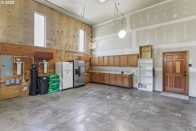 9275 SE Terrace View Ct, Amity, OR 97101 - garage with stainless steel refrigerator with ice dispenser, freestanding refrigerator, and electric panel
