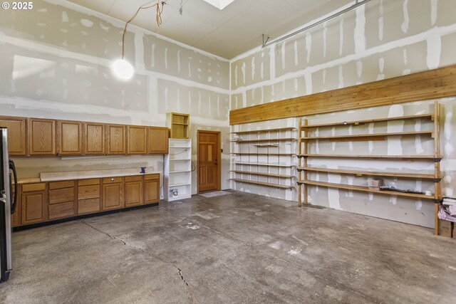 garage with freestanding refrigerator