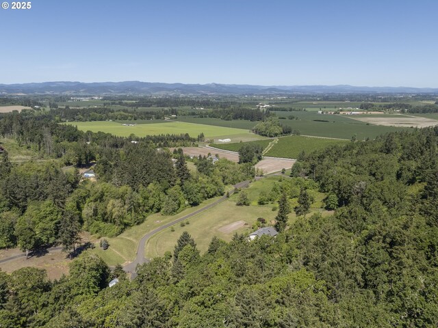 aerial view of property and surrounding area with a mountainous background