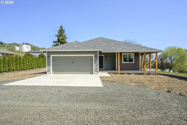 440 NW Gutbrod St, Sheridan, OR 97378 - ranch-style home with concrete driveway, a shingled roof, an attached garage, and covered porch
