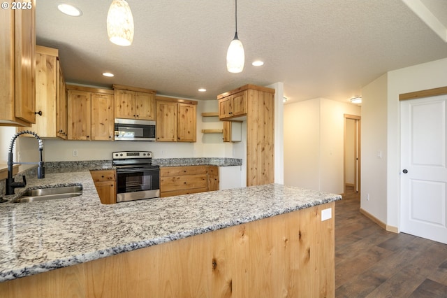 440 NW Gutbrod St, Sheridan, OR 97378 - kitchen with stainless steel microwave, dark wood-style floors, a sink, a peninsula, and range with electric stovetop