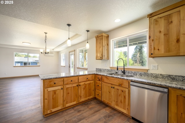 440 NW Gutbrod St, Sheridan, OR 97378 - kitchen with light stone counters, a sink, dishwasher, dark wood-type flooring, and a peninsula