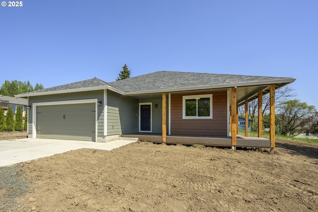 440 NW Gutbrod St, Sheridan, OR 97378 - single story home featuring a porch, driveway, a garage, and roof with shingles