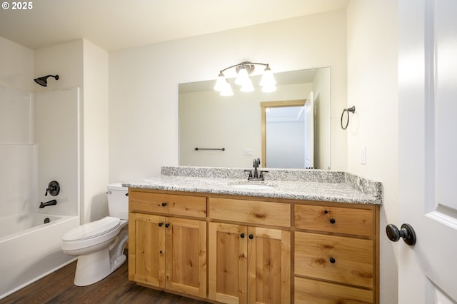 440 NW Gutbrod St, Sheridan, OR 97378 - full bath with toilet, vanity, shower / bathtub combination, and wood finished floors