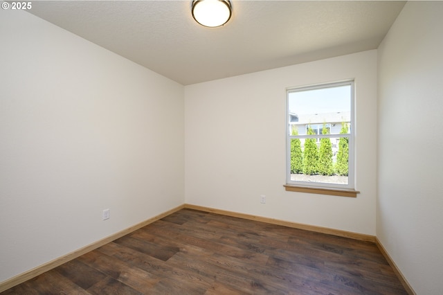 440 NW Gutbrod St, Sheridan, OR 97378 - empty room featuring dark wood-style floors and baseboards
