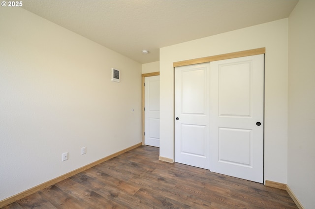 440 NW Gutbrod St, Sheridan, OR 97378 - unfurnished bedroom with dark wood finished floors and a closet