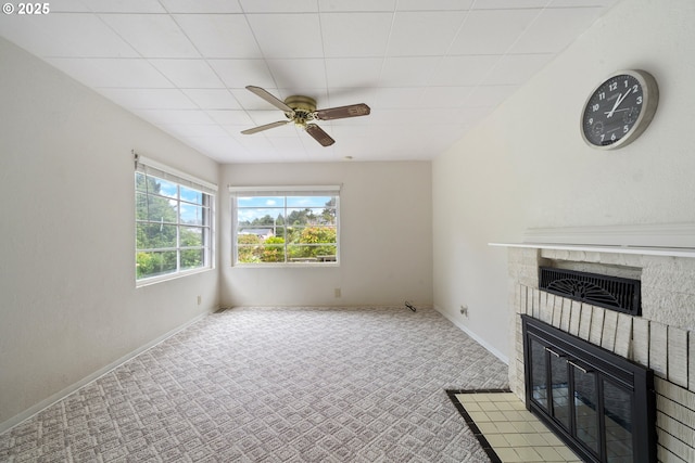 1421 SW Fleet Ave, Lincoln City, OR 97367 - unfurnished living room with a fireplace, a ceiling fan, carpet, and baseboards