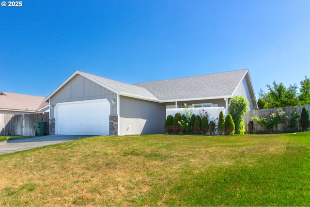 517 Anthony Dr, Boardman, OR 97818 - ranch-style house with an attached garage, driveway, and stone siding