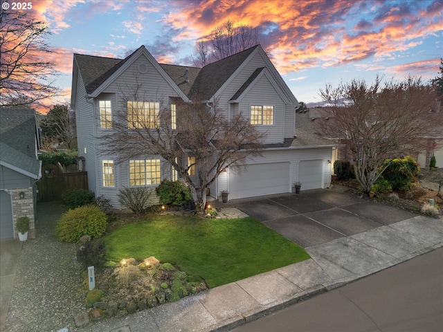 11832 SW 126th Pl, Portland, OR 97223 - traditional home featuring concrete driveway, a lawn, a garage, and roof with shingles