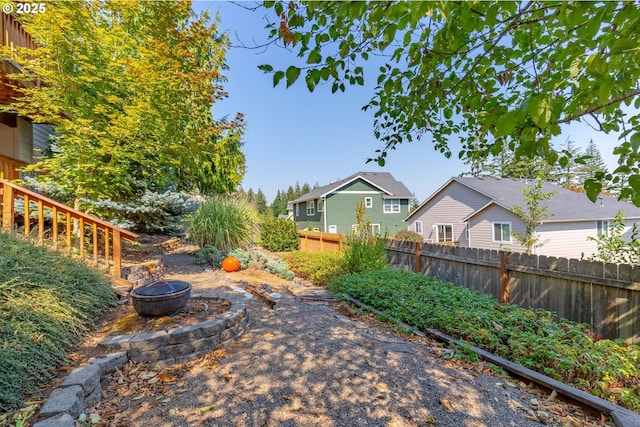 view of yard with an outdoor fire pit