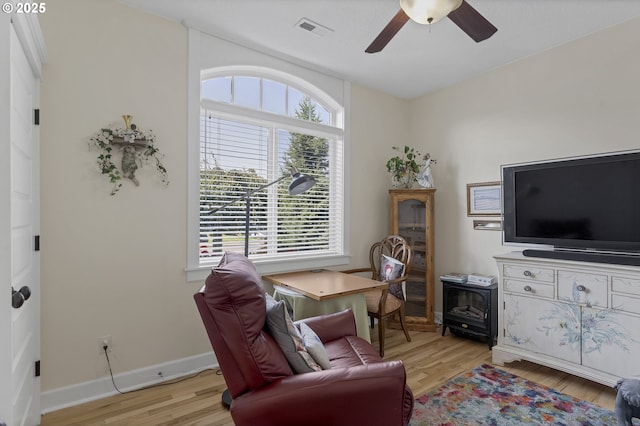 interior space with ceiling fan and light hardwood / wood-style flooring