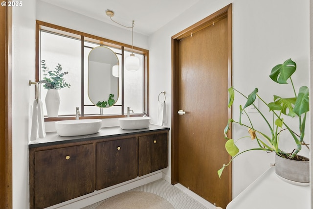 bathroom with double vanity and a sink