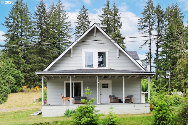 22621 Noti Loop, Noti, OR 97461 - view of front facade with covered porch, a shingled roof, and a front yard