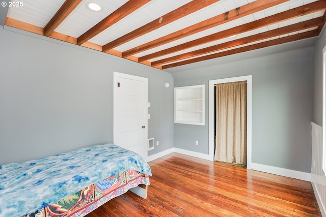 22621 Noti Loop, Noti, OR 97461 - bedroom with beamed ceiling, wood finished floors, and baseboards