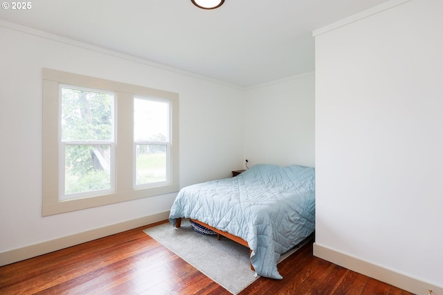 22621 Noti Loop, Noti, OR 97461 - bedroom featuring multiple windows, ornamental molding, baseboards, and wood finished floors